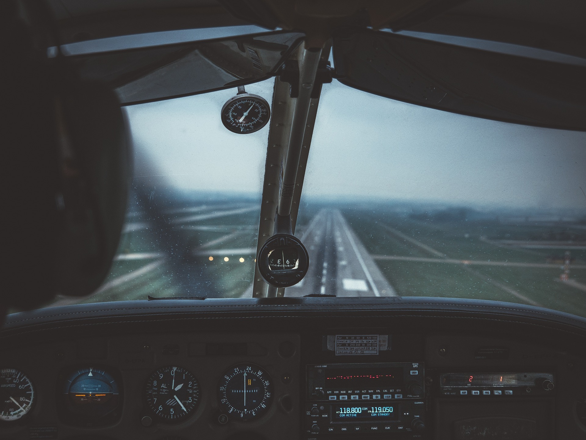 image of a cockpit with runway in sight